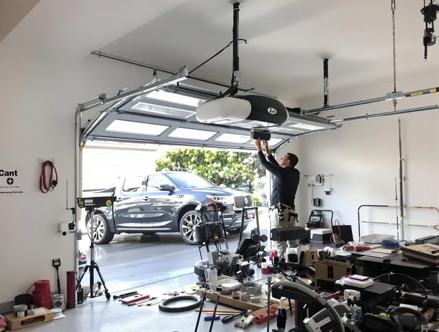 Huntington Park Garage Door Repair specialist installing smart garage door opener system in Huntington Park home